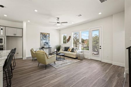 Spacious and inviting living area adorned with stylish vinyl 20mm flooring. The perfect space for relaxation and entertaining guests