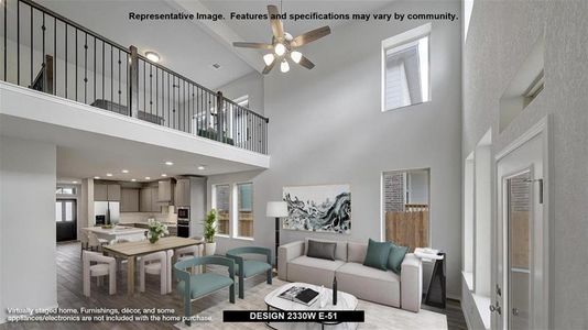 Living room featuring light hardwood / wood-style flooring, ceiling fan, and a high ceiling