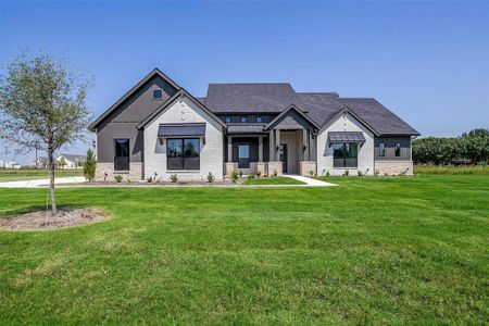 View of front of house with a front lawn