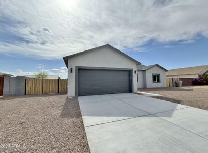 Front of home with RV gate and parking