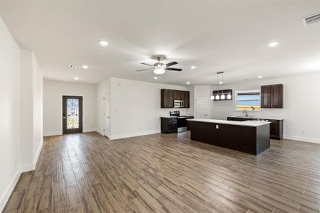 View of entry, kitchen, and living room