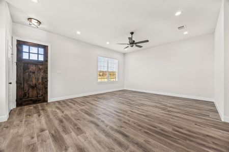 Foyer featuring hardwood / wood-style floors and ceiling fan