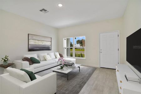 WOOD LOOK TILE FLOORS make maintenance a breeze while lending a modern aesthetic to this light and bright OPEN CONCEPT floor plan. Virtually Staged.