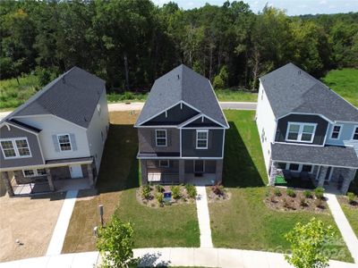 Home backs up to alley and community wooded area