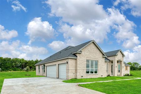 View of home's exterior with a yard