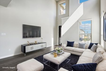 Virtually staged living room in the Medina floorplan at a Meritage Homes community.