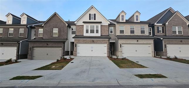 New construction Townhouse house 2777 Lou Lou Ln, Buford, GA 30519 - photo 0