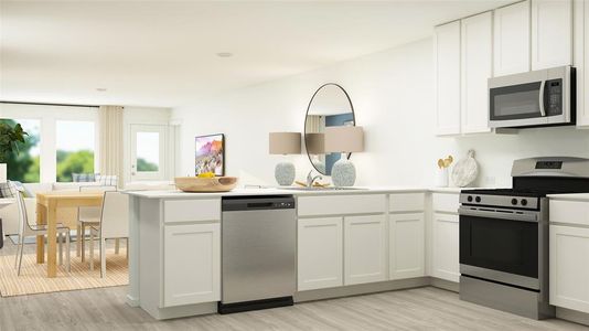 Kitchen featuring light hardwood / wood-style floors, appliances with stainless steel finishes, and white cabinetry