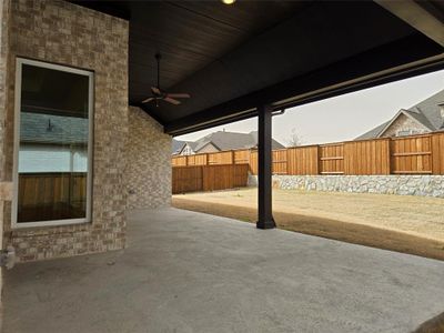 This spacious covered back patio with a view of your private back yard offers the perfect place to host fun family bbq's!