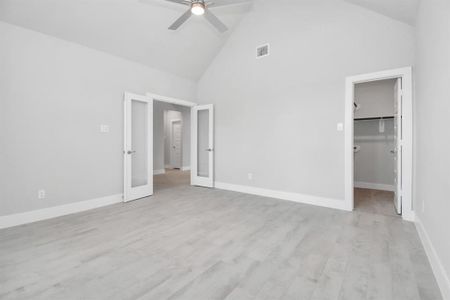 Home office on 1st floor. Equipped with glass french doors. Sample photo of completed home with similar floor plan. Actual colors and selections may vary.