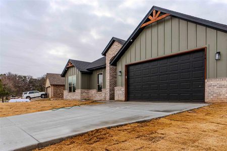 View of front facade featuring a garage