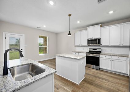 Stunning white cabinets provide plenty of storage.