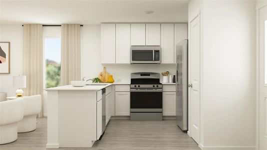 Kitchen featuring kitchen peninsula, sink, white cabinetry, appliances with stainless steel finishes, and light hardwood / wood-style floors