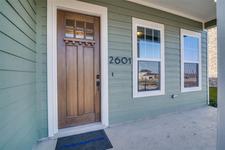 Property entrance with covered porch