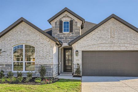 French country home with a garage