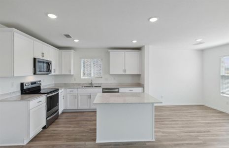 Bright kitchen with ample cabinet space *real home pictured