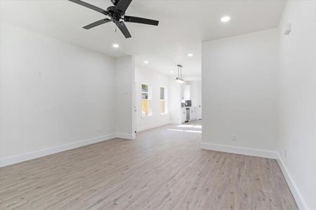 Spare room featuring ceiling fan and light hardwood / wood-style flooring