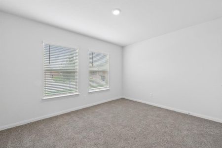 Primary bedroom featuring carpet floors