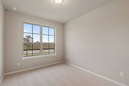 Your secondary bedroom features plush carpet, fresh paint, closet, and a large window that lets in plenty of natural lighting.