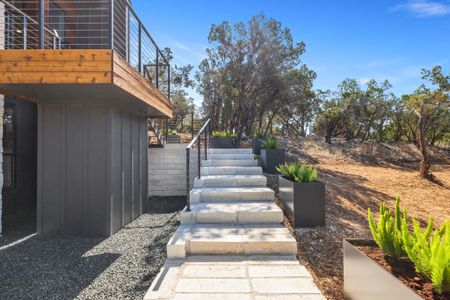 View of yard featuring stairway