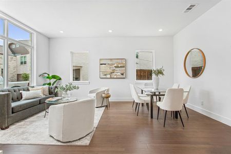 Living room with hardwood / wood-style flooring