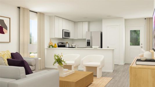 Kitchen with white cabinets, light hardwood / wood-style floors, and appliances with stainless steel finishes