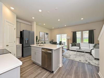 The well-appointed kitchen with a large island and generous pantry makes meal prep a breeze.