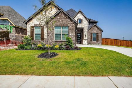 View of front of home featuring a front lawn