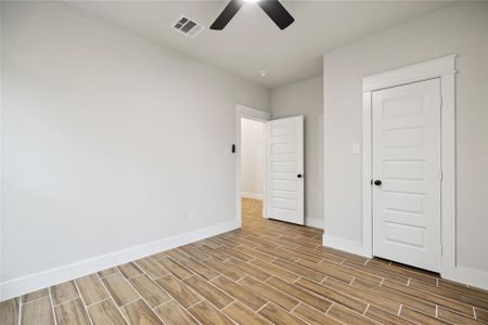 Unfurnished bedroom featuring ceiling fan