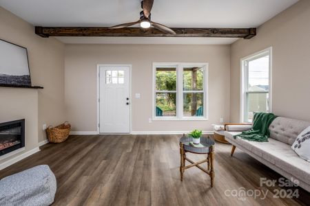 Great Room w/Exposed Faux Beams & LVP Flooring