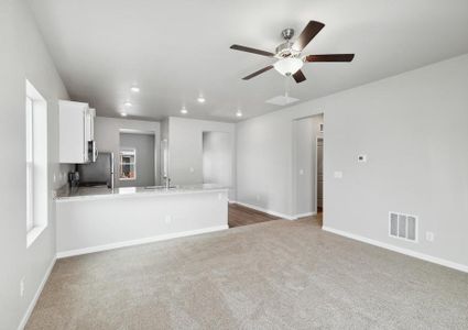 Open layout with the kitchen overlooking the large living room.