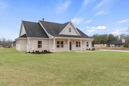 View of front of property with a front lawn