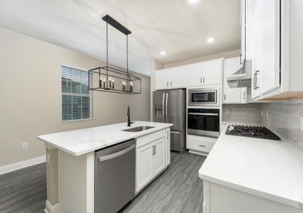 The kitchen comes with a full suite of stainless steel appliances!