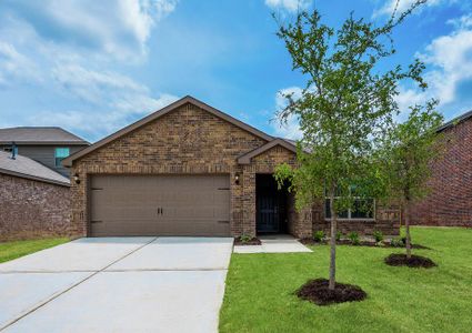 This home has an attached two-car garage and a beautiful brick exterior with lush front yard landscaping.