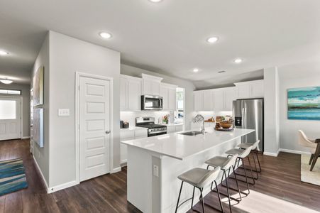 Kitchen in the Heisman home plan by Trophy Signature Homes – REPRESENTATIVE PHOTO