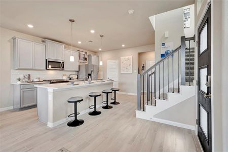 Photo is not of the actual home, but is an inspirational photo of builder’s model home and may depict options, furnishings, and/or decorator features that are not included