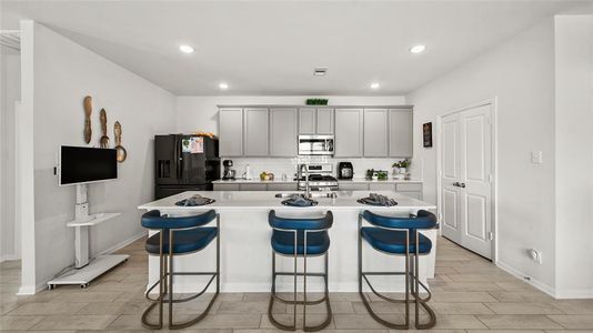 Open Kitchen concept with Granite bar top.