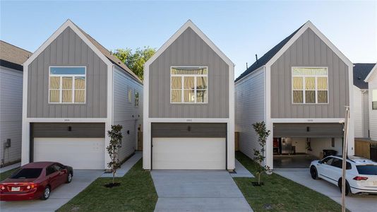 Seven new construction homes in Northside Village - each home has private driveways.