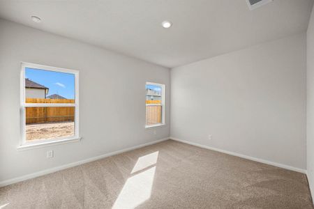 The primary bedroom is the perfect place to relax after a long day.