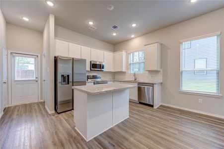 Huge island kitchen, window over the sink & granite counters!