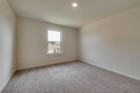 Empty room with carpet flooring