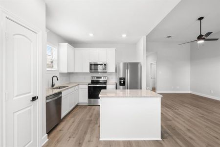 Kitchen with a glimpse of the living room.