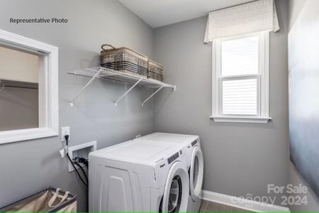 Large laundry room, featuring a convenient chute from one of the primary closets