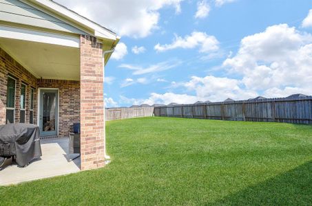 Covered patio has gas line connection for grill