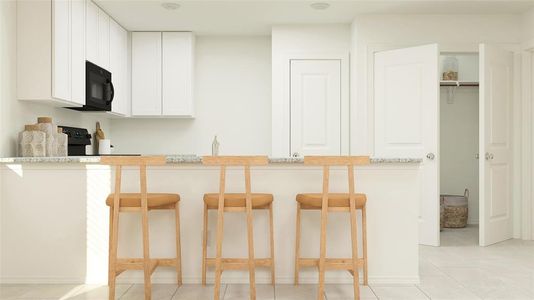 Kitchen with light stone counters, a breakfast bar, light tile patterned flooring, kitchen peninsula, and white cabinetry