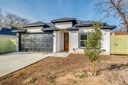 Prairie-style home with a garage