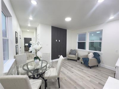 Dining space with light hardwood / wood-style floors