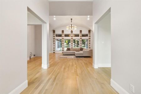 Foyer looking into family room and wall of windows