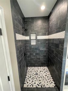 Bathroom with tiled shower