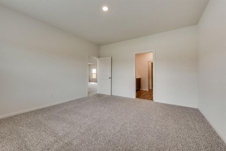 Unfurnished room featuring carpet flooring